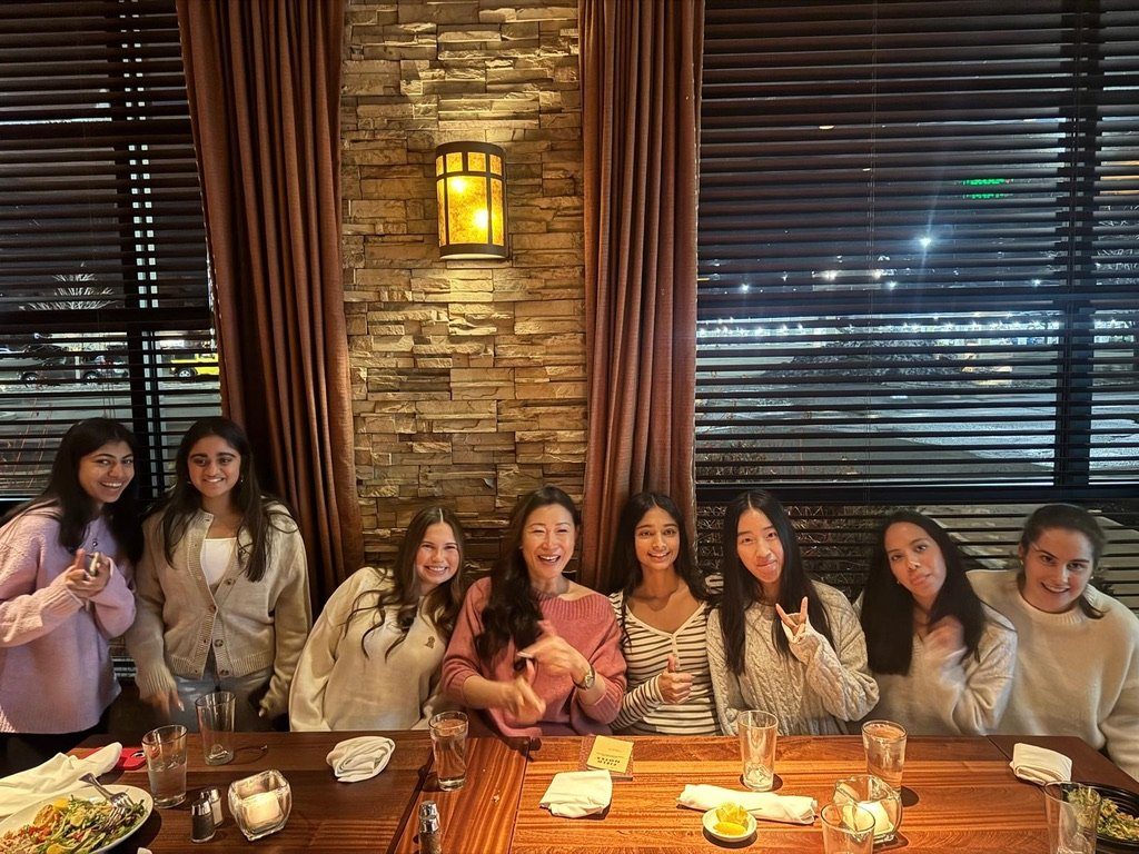 Students sharing a dinner and conversation with entrepreneur Jenny Jing Zhu at 52 Seasons