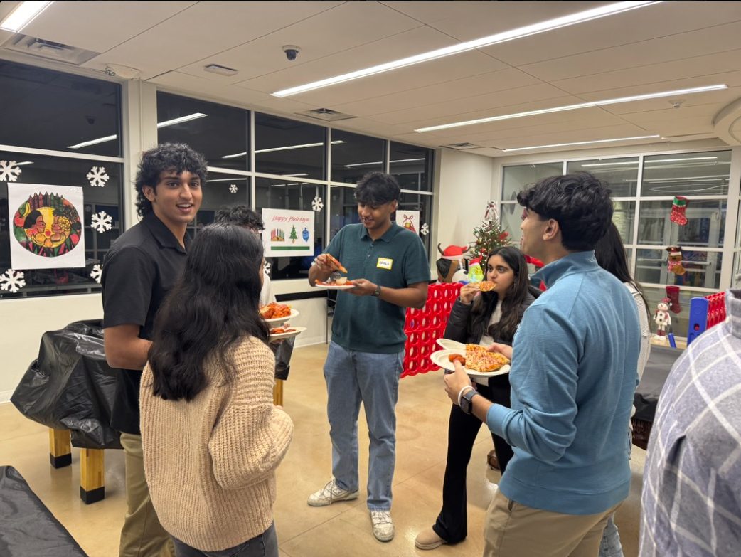 Students sharing a meal and conversation at an Entrées dinner