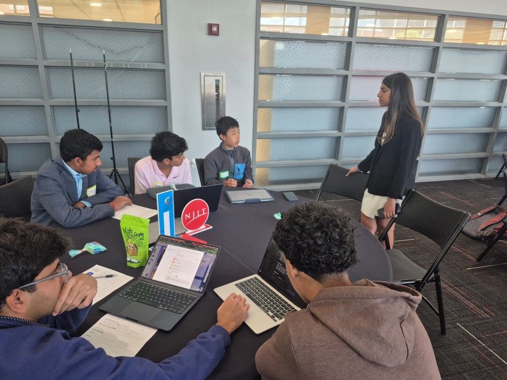 Mentor coaching a team at Entrepreneurathon 2026