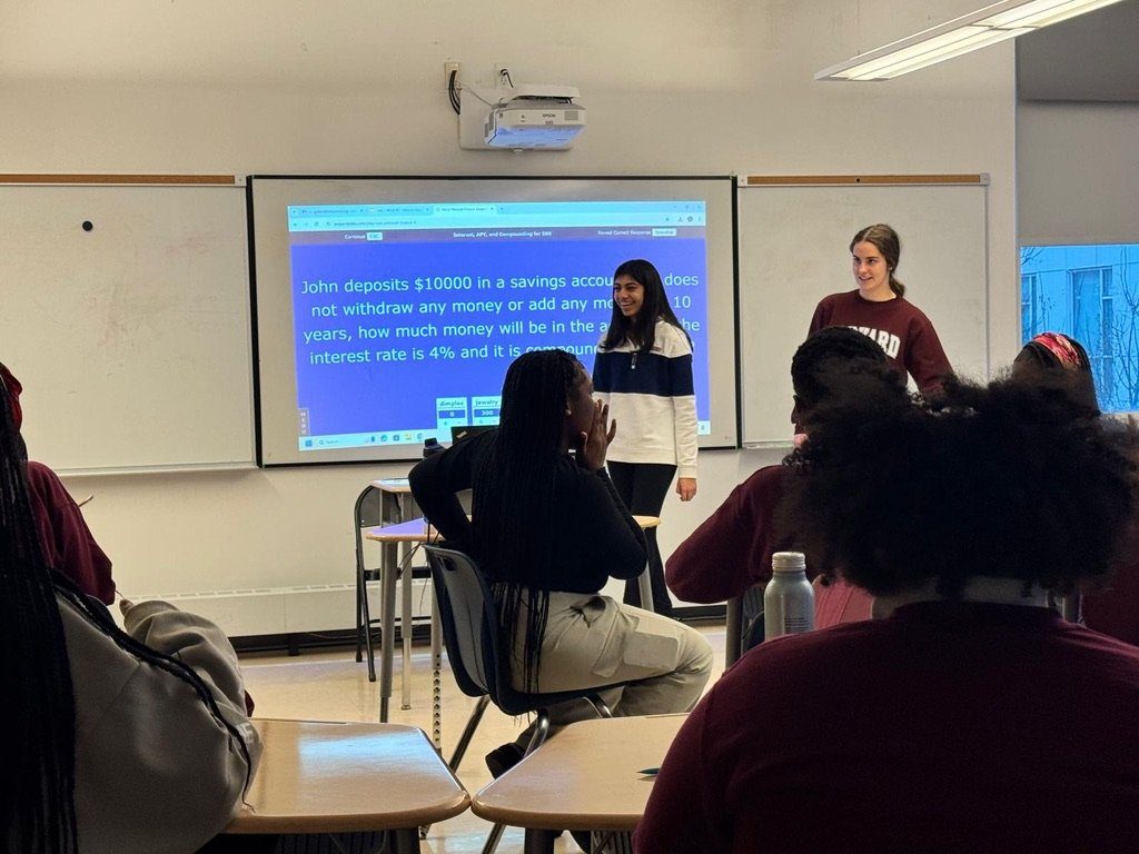 A savings and interest question on screen during a workshop